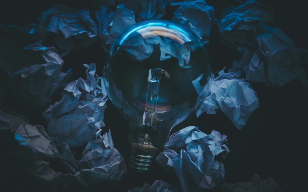 lightbulb surrounded by paper